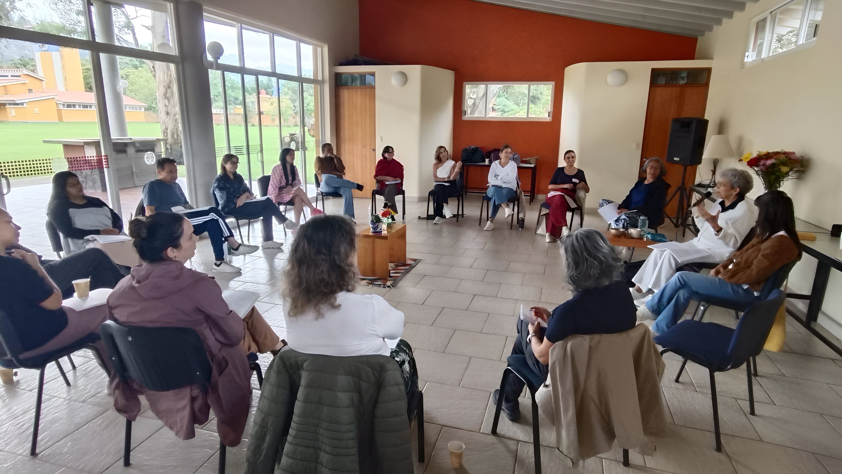 Participants seated in a circle during a group workshop